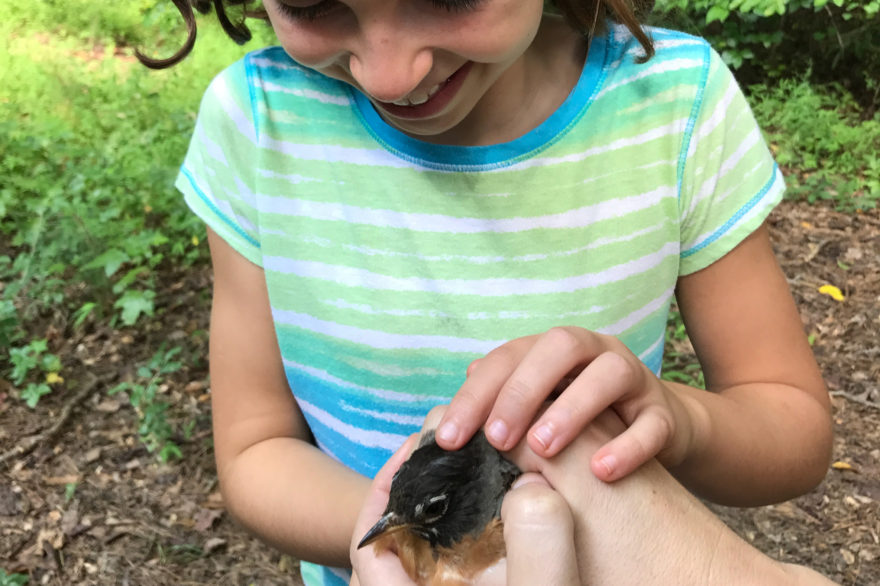 Mom and child with bird